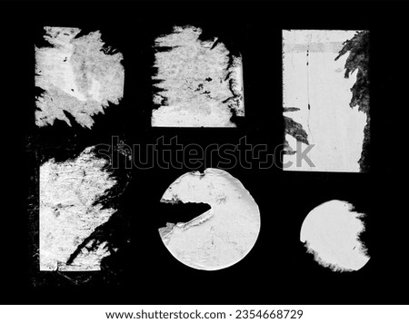 Set of Old Grunge Torn Ripped Paper Pieces and Round Stickers Isolated On Black Background. Urban Wall Poster Texture. High Quality Distressed Elements For Mixed Media Collage.