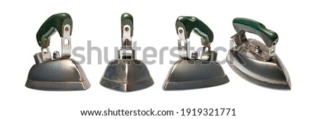Set of old iron.  Four old electric iron isolated on white background. Old household appliances. Selective soft focus.