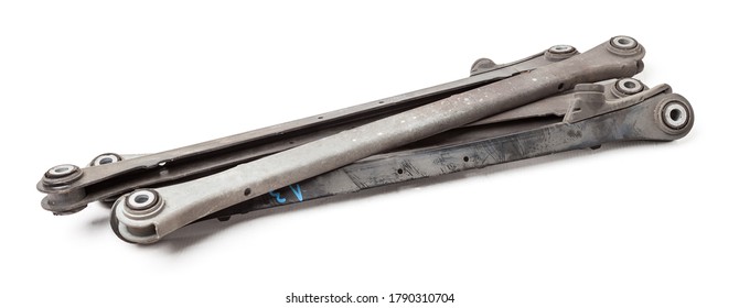 A Set Of Old Metal Chassis Levers Covered With Rust On A White Background In A Photo Studio. Spare Parts For Repair In The Workshop Or Sale Of Auto Parts On Auto Parsing.