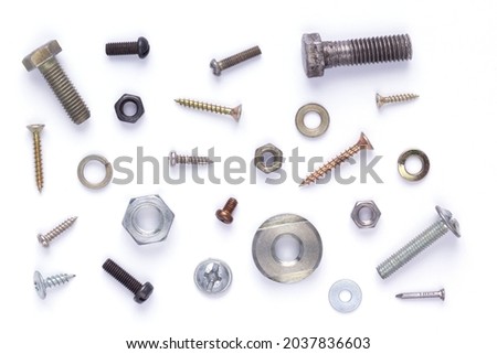 Set of old metal screw, bolt head, nut, washer and nail tool on white background