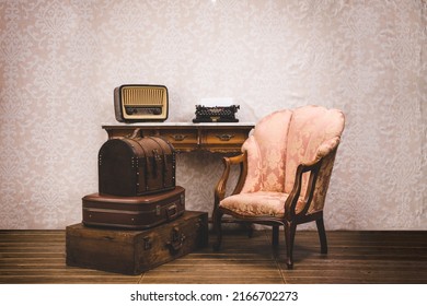 Set of old vintage suitcases, typewriter, armchair and radio. Vintage retro style concept.