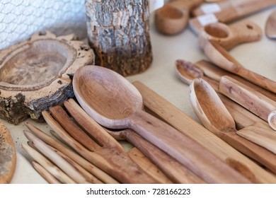 Set Of Old Wooden Spoons And Forks For The Kitchen.