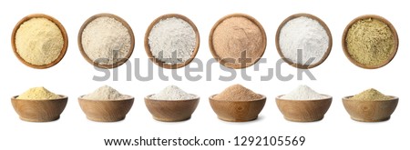 Set of organic flour in wooden bowls on white background