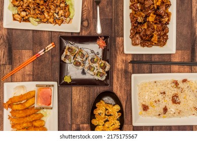 Set Of Oriental Food Dishes With Panko Battered Shrimp, Fried Wonton, Ham Rice, Red Tuna Rice Roll And Beef With Bamboo And Mushroom, Soy Sauce And Sweet And Sour Sauce