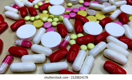 Set of pain medication pills in different colors. Vaccine and antidote in bright capsules