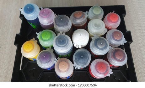 A set of paints for coloring models according to Warhammer 40 000.  A set of paints in a special stand for Warhammer paints.