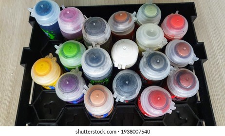 A set of paints for coloring models according to Warhammer 40 000.  A set of paints in a special stand for Warhammer paints.