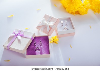 Set Of Pearl And Amethyst Jewellery In Gift Boxes With Yellow Flowers