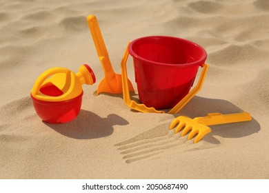 Set Of Plastic Beach Toys On Sand. Outdoor Play