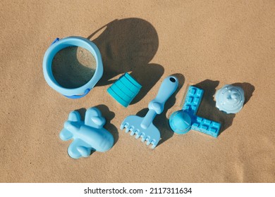Set Of Plastic Beach Toys On Sand, Flat Lay. Outdoor Play
