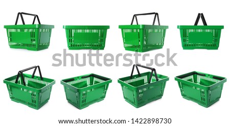 Set of plastic shopping baskets on white background 