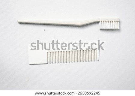 Set of Plastic Toothbrushes and Combs isolated on White Background