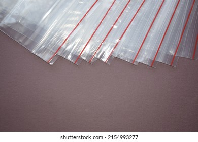 A set of plastic zip bags. Transparent plastic bags on a dark background.