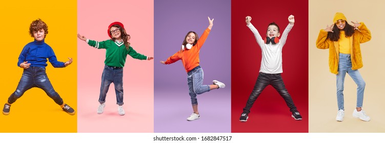 Set Of Playful Multiracial Preteen Children In Trendy Casual Wear Having Fun While Standing Against Bright Background In Studio