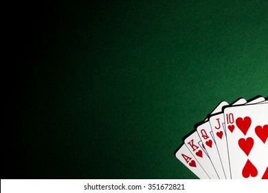 set of poker cards on a green background with space for text