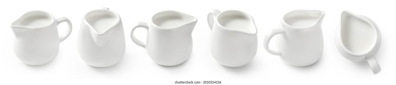 Set of porcelain milk jars isolated on white background. Milk pitchers for package design. Collection of ceramic milk creamers on white. Top view of milk. - Shutterstock ID 2010314156