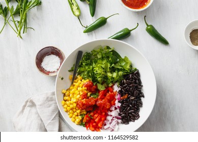 Set Of Prepared Products For The Cooking Of Taco Salad On White Wooden Table, Top View