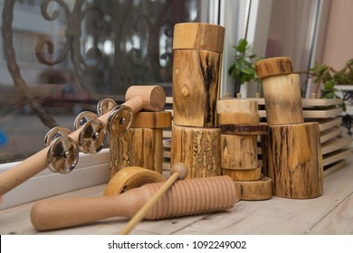A set of primitive natural wood musical instruments for children. Montessori school concept. Autism therapy concept.