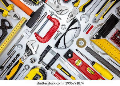 Set Of Professional Construction Tools And Safety Glasses On Metal Workbench. Top View