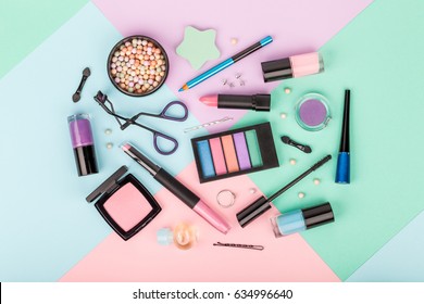 set of professional decorative cosmetics, makeup tools and accessory on multicolored background. beauty, fashion, party and shopping concept. flat lay composition, top view - Shutterstock ID 634996640