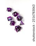 Set of purple dice for rpg, dnd or board games on a light background. polyhedral dice (d4, d6, d8, d10, d12 and d20) for fantasy games