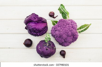 Set of purple vegetables on white wooden table - healthy food top view. - Powered by Shutterstock