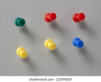 Set of push pins in different colors, with real shadows, isolated on gray background. - Shutterstock ID 223596019