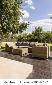 Set Of Rattan Garden Furniture In A Sunny Deck Terrace 