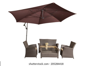 Set of rattan garden furniture under a big garden umbrella isolated on white - Shutterstock ID 205284418