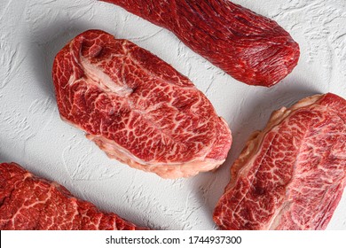 Set Of Raw Denver, Top Blade, Tri Tip Steak, Machete, Flank, Bavette London Broil Marble Beef On White Background Top View Close Up