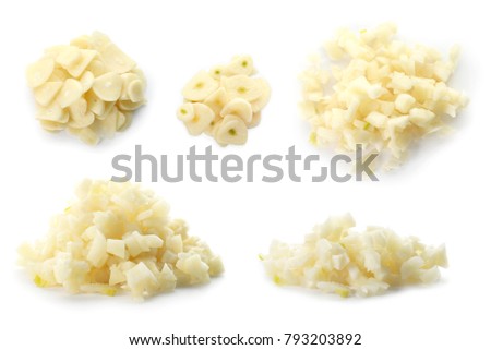 Set with raw fresh chopped garlic on white background