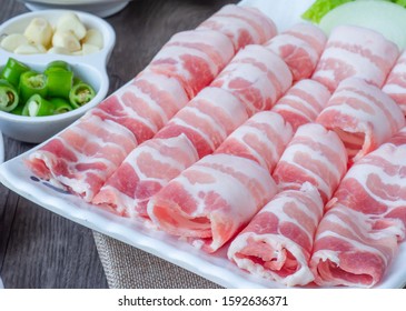 Set of raw fresh pork slide in white plate serve with many kind of vegetable, korean style for food issue. 