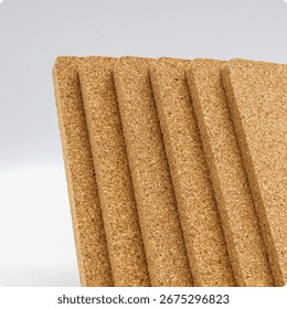 Set of rectangular cork boards arranged vertically, showing natural texture and smooth edges for crafts, insulation, or pinboards.