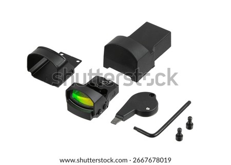 A set of red dot sight components on a white background.