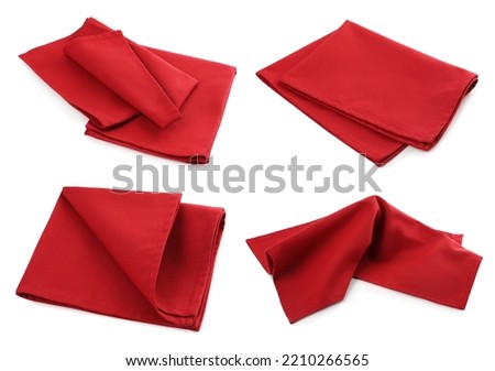 Set with red fabric napkins on white background