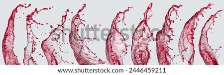 Set of red wine splashes on a light grey background.