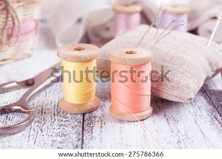 Set of reel of thread, scissors, needle and pins for sewing and needlework