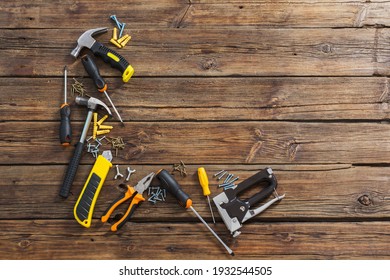 set of repair tools on old wooden background