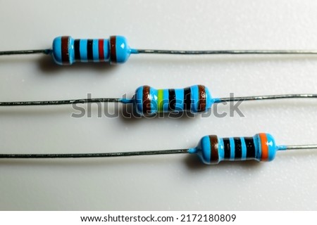 A set of resistors on a white background. Macro picture. Electronic components. High resistance for reducing current flow.