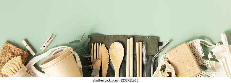 Set of reusable eco friendly products . Zero waste concept. Eco natural paper cups, bamboo cutlery, natural cleaning products , flat lay. Plastic free sustainable lifestyle concept banner - Powered by Shutterstock