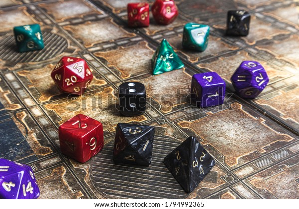 Set of role\
playing dice on a gaming mat.\
