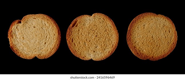 Set round bread rusks, whole wheat toast slices isolated on black background, top view