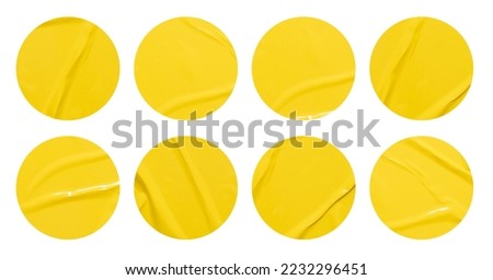 Set of round yellow paper stickers mock up blank tags labels, isolated on white background with clipping path for design work
