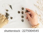 Set of rune stones for divination and fortune telling. Mystic still life with labradorite runes. Esoteric, occult , witchcraft rituals idea