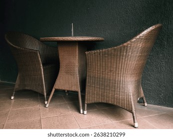 set of rustic wooden chairs and table with an industrial wall background