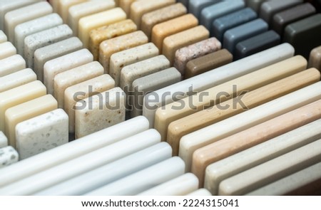 A set of samples of stones for decorative interior decoration. Beautiful set of marble and granite with stains, onyx surface. Finishing stone for furniture and interior.