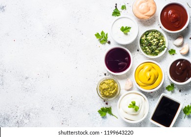 Set Of Sauces - Ketchup, Mayonnaise, Mustard Soy Sauce, Bbq Sauce, Pesto, Chimichurri, Mustard Grains And Pomegranate Sauce On White Background.