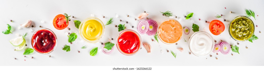 Set Of Sauces In Small Bowls - Ketchup, Mayonnaise, Mustard, Bbq Sauce, Pesto, Classic Burger Sauce, With Spices And Herbs In. White Background Copy Space Top View