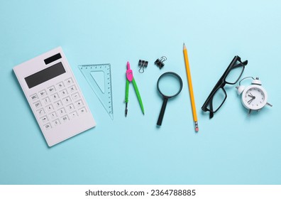 Set of school supplies on a blue background. Top idl - Shutterstock ID 2364788885
