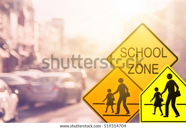 Set of
School zone warning sign on blur traffic road with colorful bokeh
light abstract background. Copy space of transportation and travel
concept. Vintage tone filter color
style.